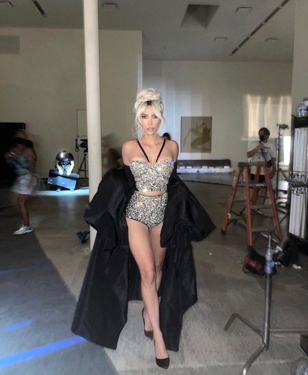 Kim Kardashian sets hearts racing in rhinestone two-piece and trench coat Kim Kardashian sets hearts racing in rhinestone two-piece and trench coat