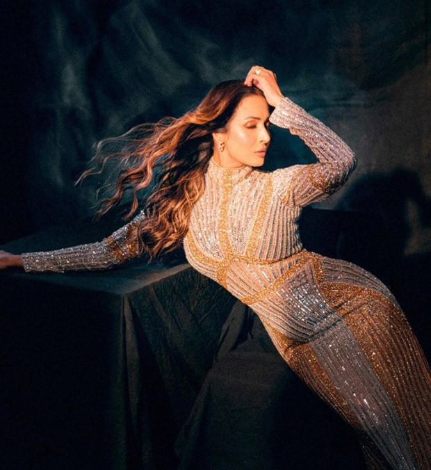Malaika Arora exudes glitz and glam in a gold shimmering body-con gown 