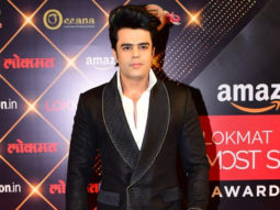 Maniesh Paul poses for paps in a stylish black suit