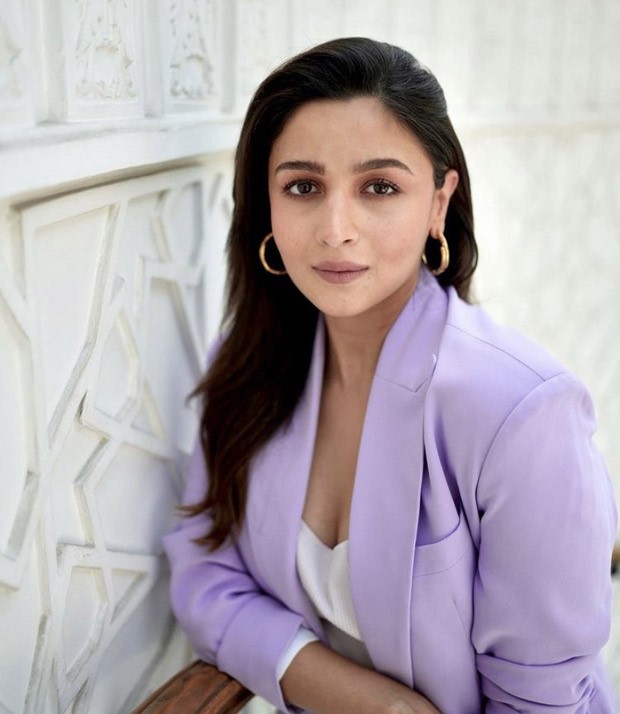 Mom-to-be Alia Bhatt looks cute in an ensemble of a purple blazer, jeans, and vibrant heels