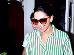 Deepika Padukone smiles for paps in a green striped oversized shirt