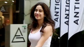 Janhvi Kapoor smiles for paps in orange gym shorts