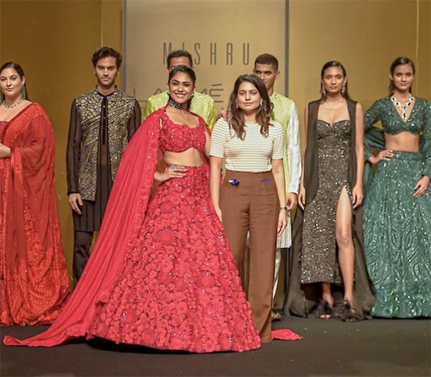 Mrunal Thakur dons three-piece crimson lehenga by Mishru as she walks the runway at The FDCI x Lakmé Fashion Week Mrunal Thakur dons three-piece crimson lehenga by Mishru as she walks the runway at The FDCI x Lakmé Fashion Week