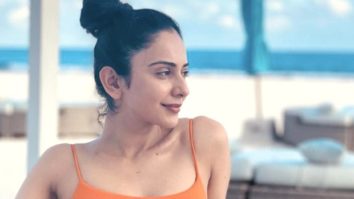 Rakul Preet Singh says, “Thank God for a holiday” as she relaxes on the beach in the Maldives while wearing an orange swimsuit