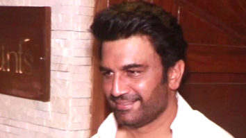 Sharad Kelkar smiles in a white shirt as he poses for paps