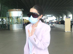 Uorfi Javed clicked at the airport in white tshirt and pink overcoat