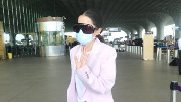 Uorfi Javed clicked at the airport in white tshirt and pink overcoat