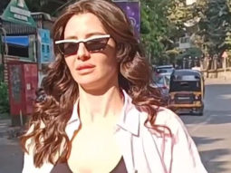 Giorgia Andriani smiles as she poses for paps in gym wear