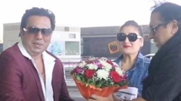 Govinda poses with his look alike at the airport with wife