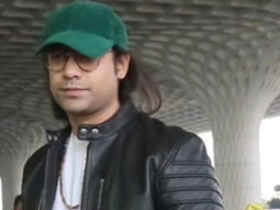 Jubin Nautiyal looks dapper in a leather jacket and green cap as he poses for paps