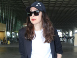 Karisma Kapoor poses for paps at the airport