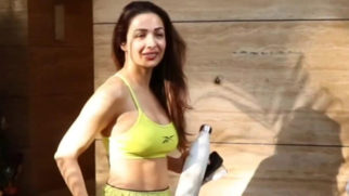 Malaika Arora smiles for paps in neon outfit outside gym