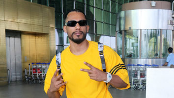 Dino James greets paps in a bright yellow tshirt at the airport