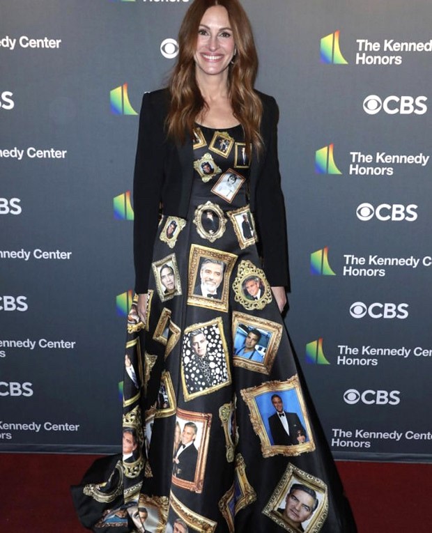 Julia Roberts honours George Clooney in a gown covered with pictures of the actor