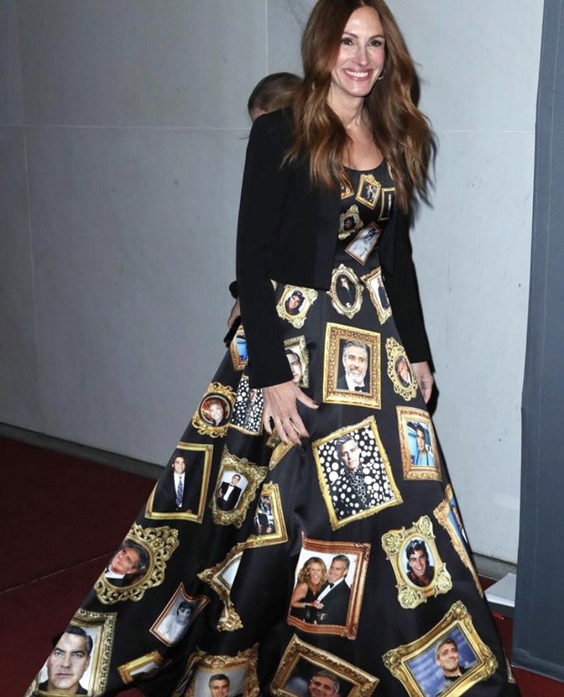 Julia Roberts honours George Clooney in a gown covered with pictures of the actor