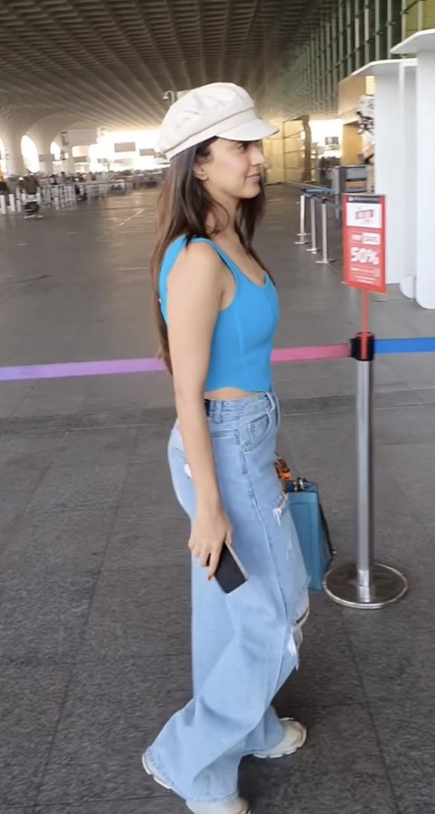 Kiara Advani jets off for New Year's getaway while donning a chic ensemble of a blue corset top, ripped jeans, and a Gucci purse that costs Rs. 2.96 Lakh