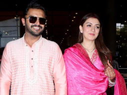 Newly wed Hansika Motwani walks hand in hand with her husband at the airport