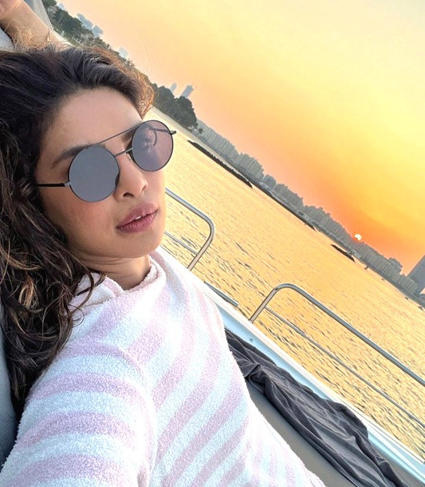 Priyanka Chopra gives a glimpse of her ideal weekend in a yellow swimsuit; includes jet skiing, sipping wine, and sunbathing in the Dubai