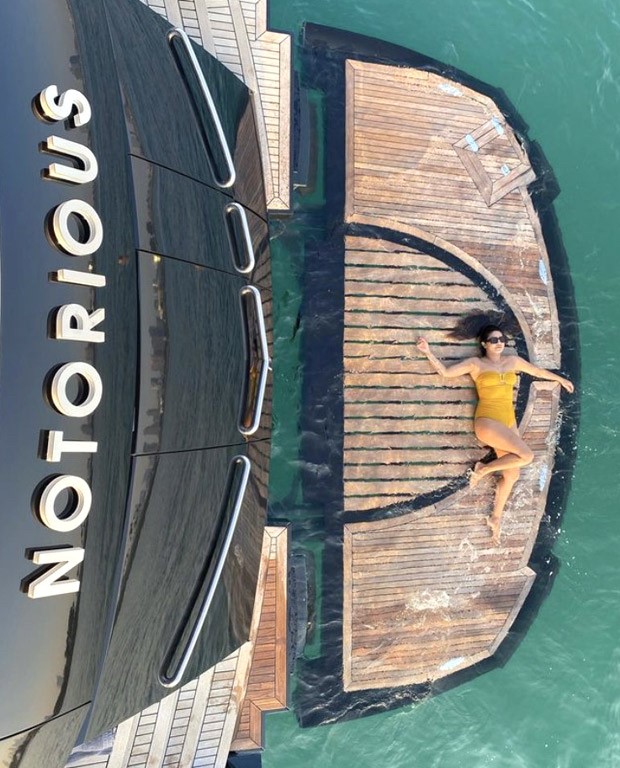 Priyanka Chopra gives a glimpse of her ideal weekend in a yellow swimsuit; includes jet skiing, sipping wine, and sunbathing in the Dubai