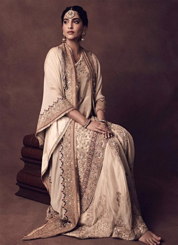 Sonam Kapoor sports an ethereal ivory Anamika Khanna costume that perfectly embodies the opulent dress code