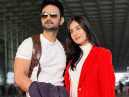 Amrita Rao and RJ Anmol pose for paps at the airport