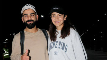 Anushka Sharma and Virat Kohli twin in white as they pose for paps