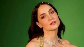 Elli AvrRam twirls around in a gorgeous green lehenga