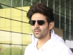 Kartik Aaryan poses for paps in a white hoodie at the airport