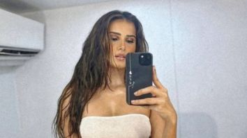 Tara Sutaria wears a white tube top with unbuttoned jeans in the most dramatic way
