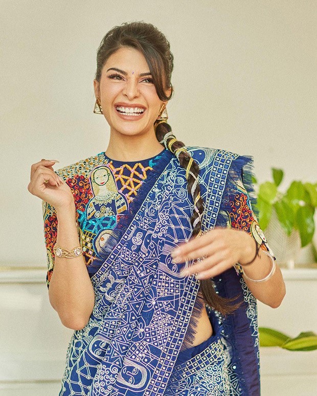 Youll appear like the most stylish wedding guest around in this blue abstract saree by Abu Jani Sandeep Khosla worn by Jacqueline Fernandez 5