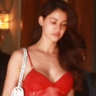 Disha Patani looks crackling dressed in a sexy red top with denims