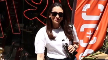 Karisma Kapoor poses for paps rocking a pair of jeans & white top