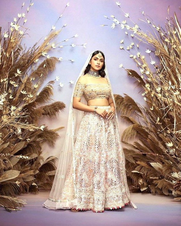 Mrunal Thakur looked like a princess as she walked the runway in an exquisite lehenga with mirror work for the Abu Jani Sandeep Khosla Fashion Show