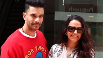 Neha Dhupia and Angad Bedi pose together for paps as they get clicked in the city