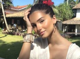 Tara Sutaria is the chicest beach beauty as she basks in the sun sporting a breezy white outfit and a red flower in her hair