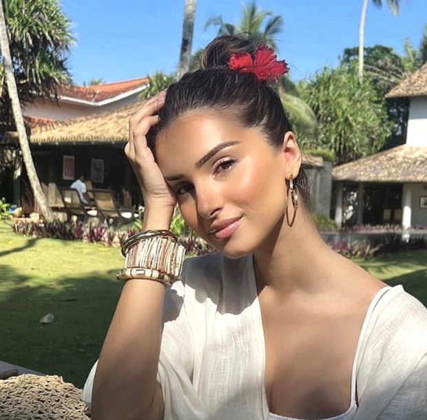 Tara Sutaria is the chicest beach beauty as she basks in the sun sporting a breezy white outfit and a red flower in her hair