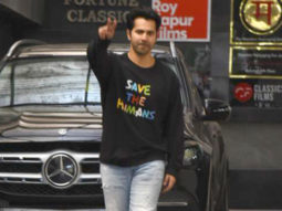 Varun Dhawan smiles as he poses for paps