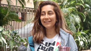 Anusha Dandekar poses for paps on a bike in her gym outfit