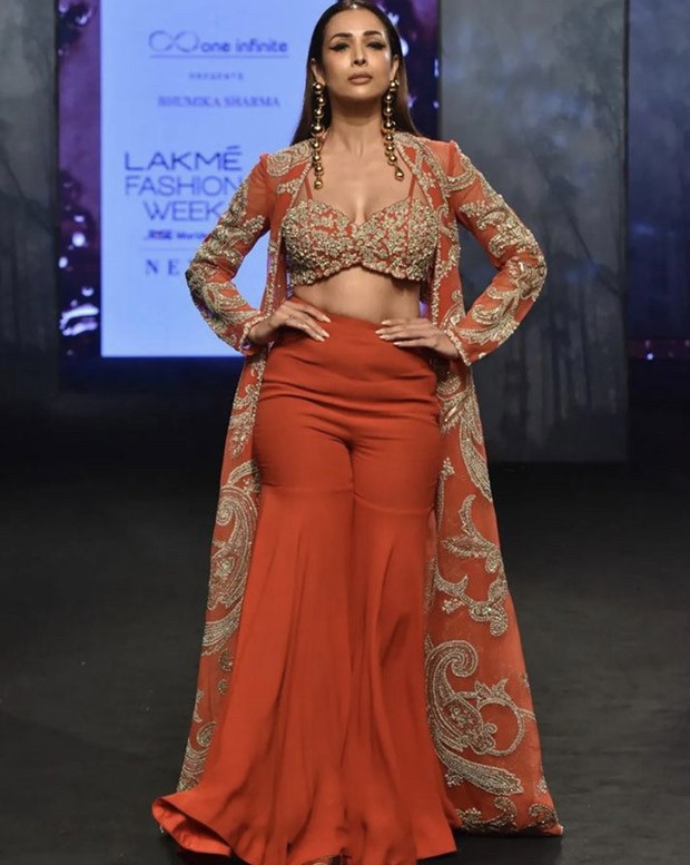 Malaika Arora steals the show in an equally classic and contemporary crimson sharara and jacket by Bhumika Sharma during Lakme Fashion Week Malaika Arora steals the show in an equally classic and contemporary crimson sharara and jacket by Bhumika Sharma during Lakme Fashion Week