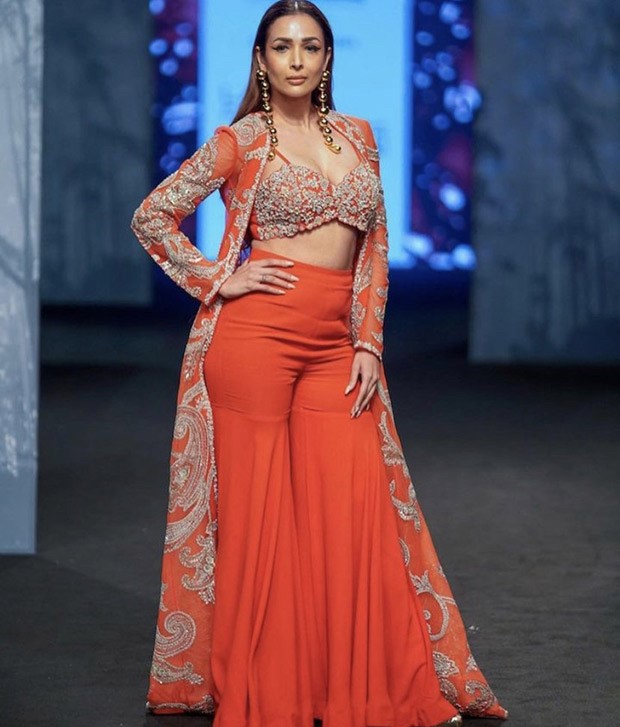Malaika Arora steals the show in an equally classic and contemporary crimson sharara and jacket by Bhumika Sharma during Lakme Fashion Week Malaika Arora steals the show in an equally classic and contemporary crimson sharara and jacket by Bhumika Sharma during Lakme Fashion Week