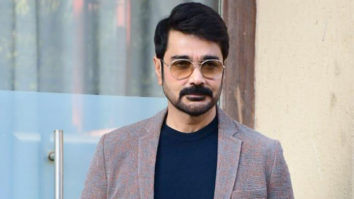 Prosenjit Chatterji poses for paps with a coffee mug
