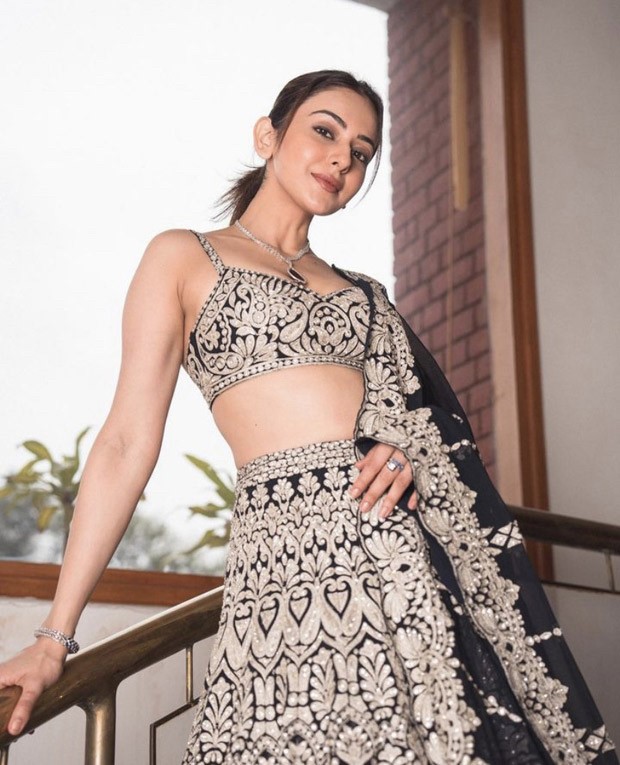 We can't hold still looking at Rakul Preet Singh in an embroidered navy lehenga by Seema Gujral 