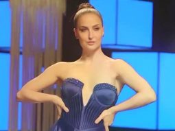 Elli AvrRam slays the runway in this glittery blue gown