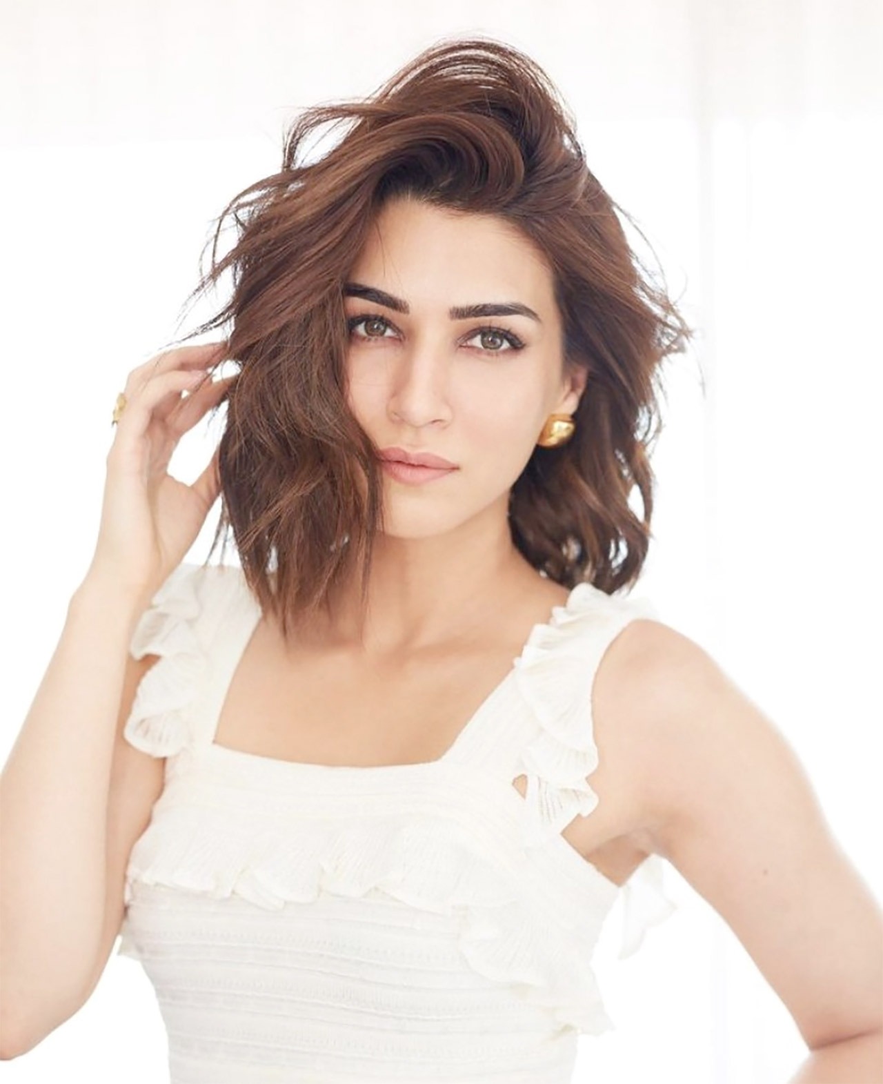 Kriti Sanon in a white frill midi dress worth Rs. 68,000 is radiating summer vibes