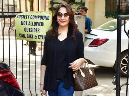 Madhuri Dixit poses for paps sporting a sharp look