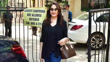 Madhuri Dixit poses for paps sporting a sharp look