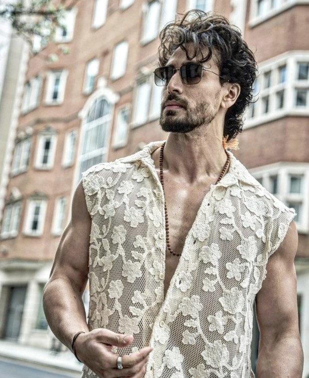 Tiger Shroff is making the streets of London appear more spirited with a sleeveless lace floral shirt and denims
