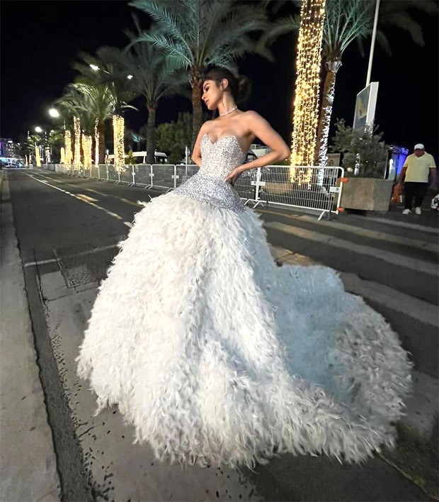 Cannes 2023 Mouni Roy packs drama and glitz as she makes her red carpet debut in a silver feather gown with a side of sparkle