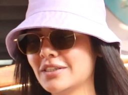 Esha Gupta opts for an oversized airport look paired with bucket hat