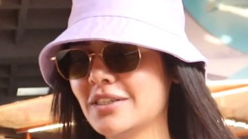 Esha Gupta opts for an oversized airport look paired with bucket hat